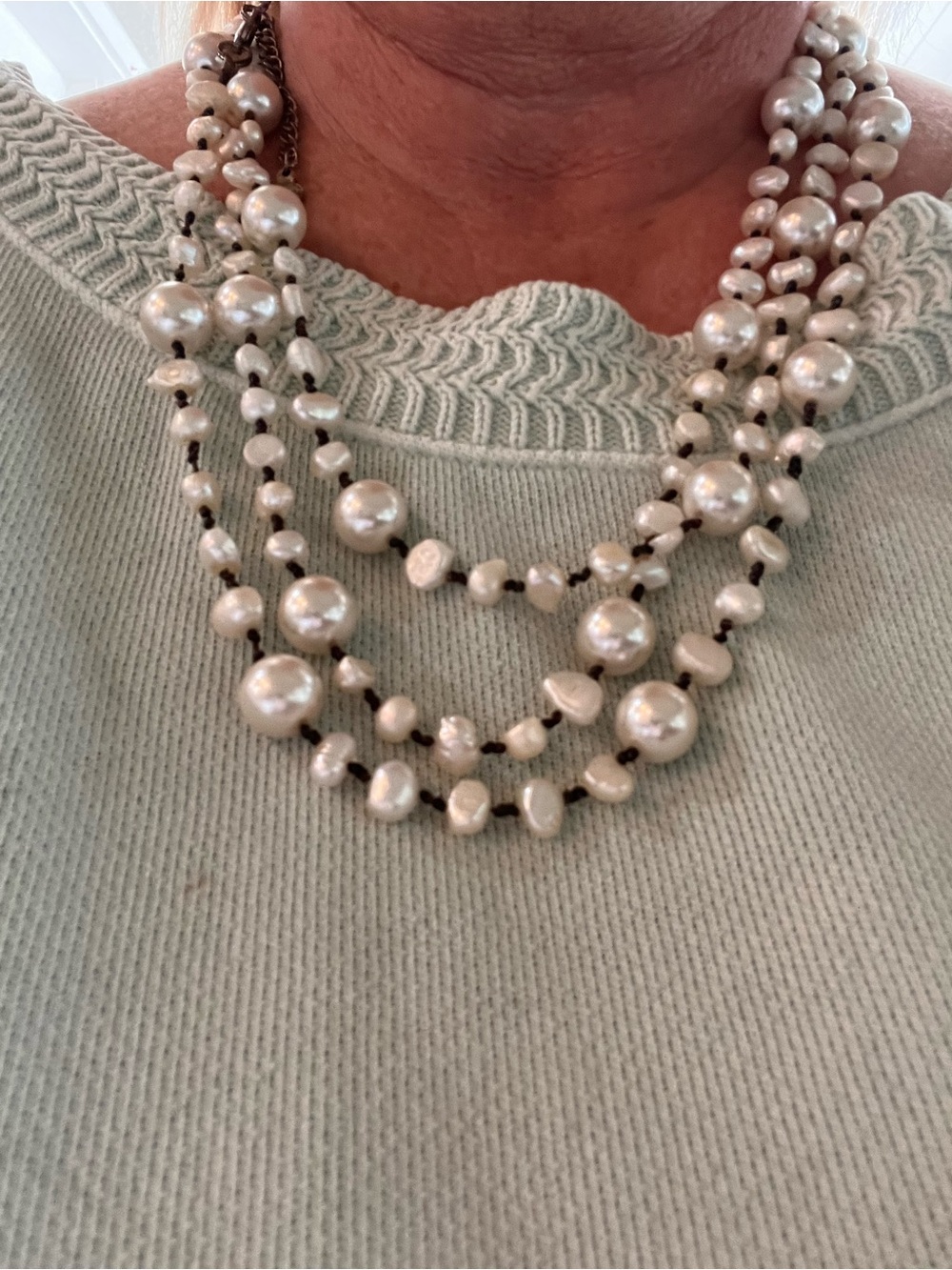 Long strand pearl necklace
